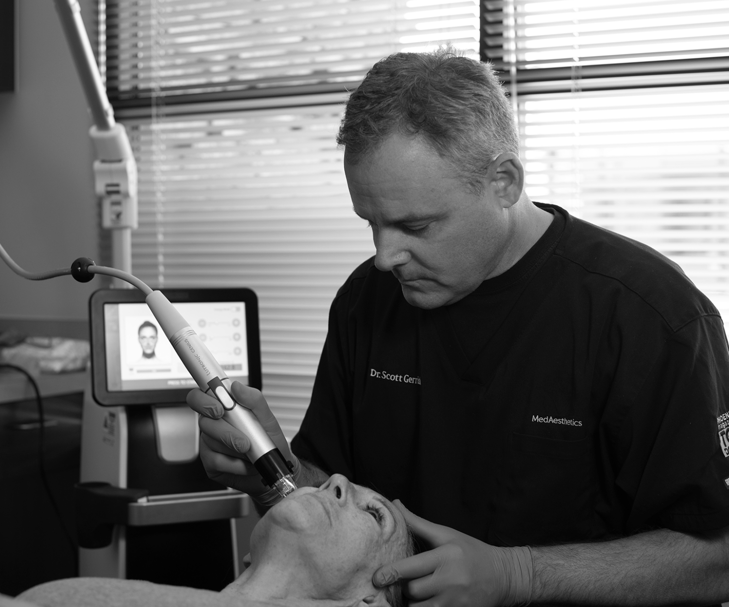 Dr Scott Gerrish doing Silent Lift Treatment on patient